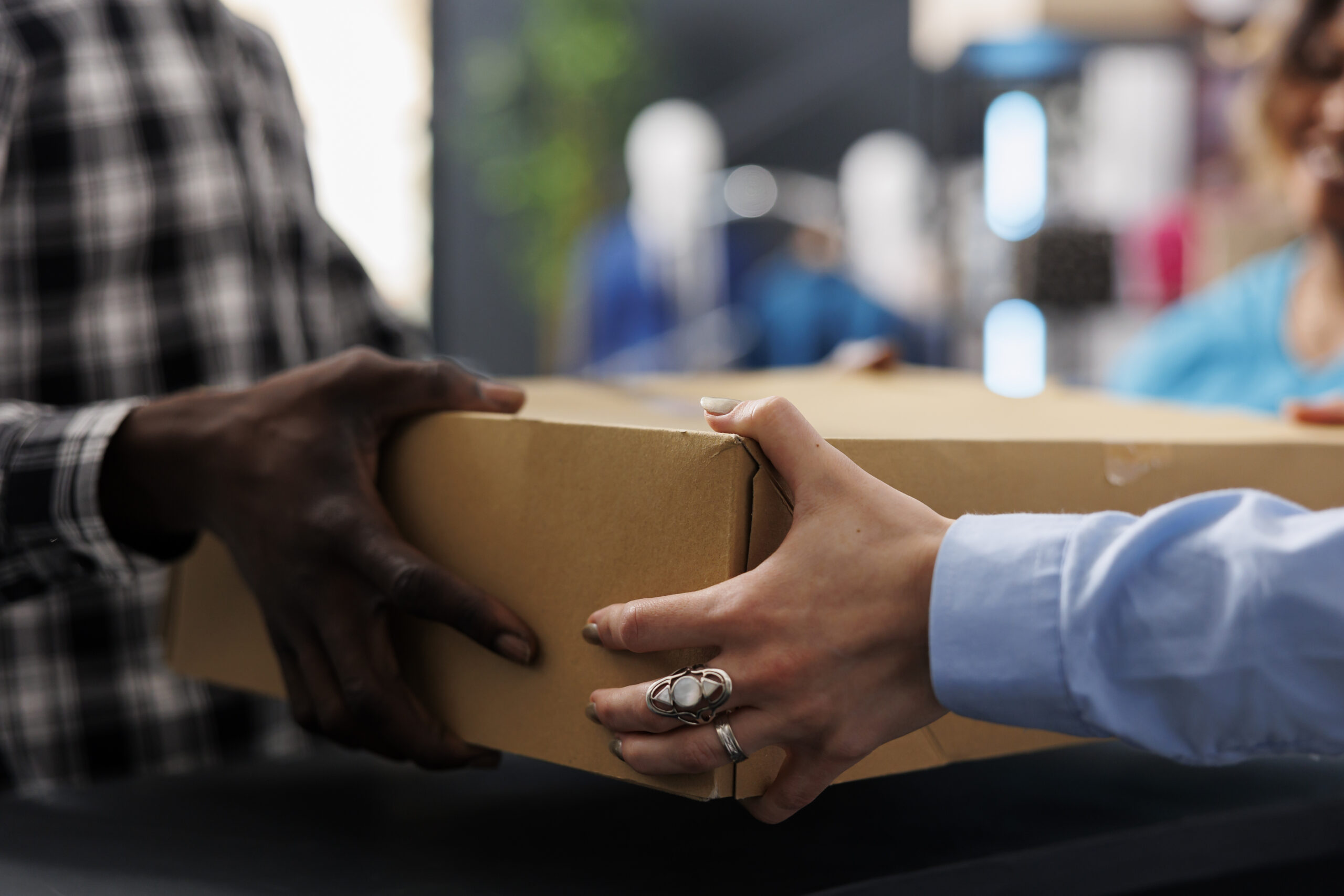 two people holding parcel